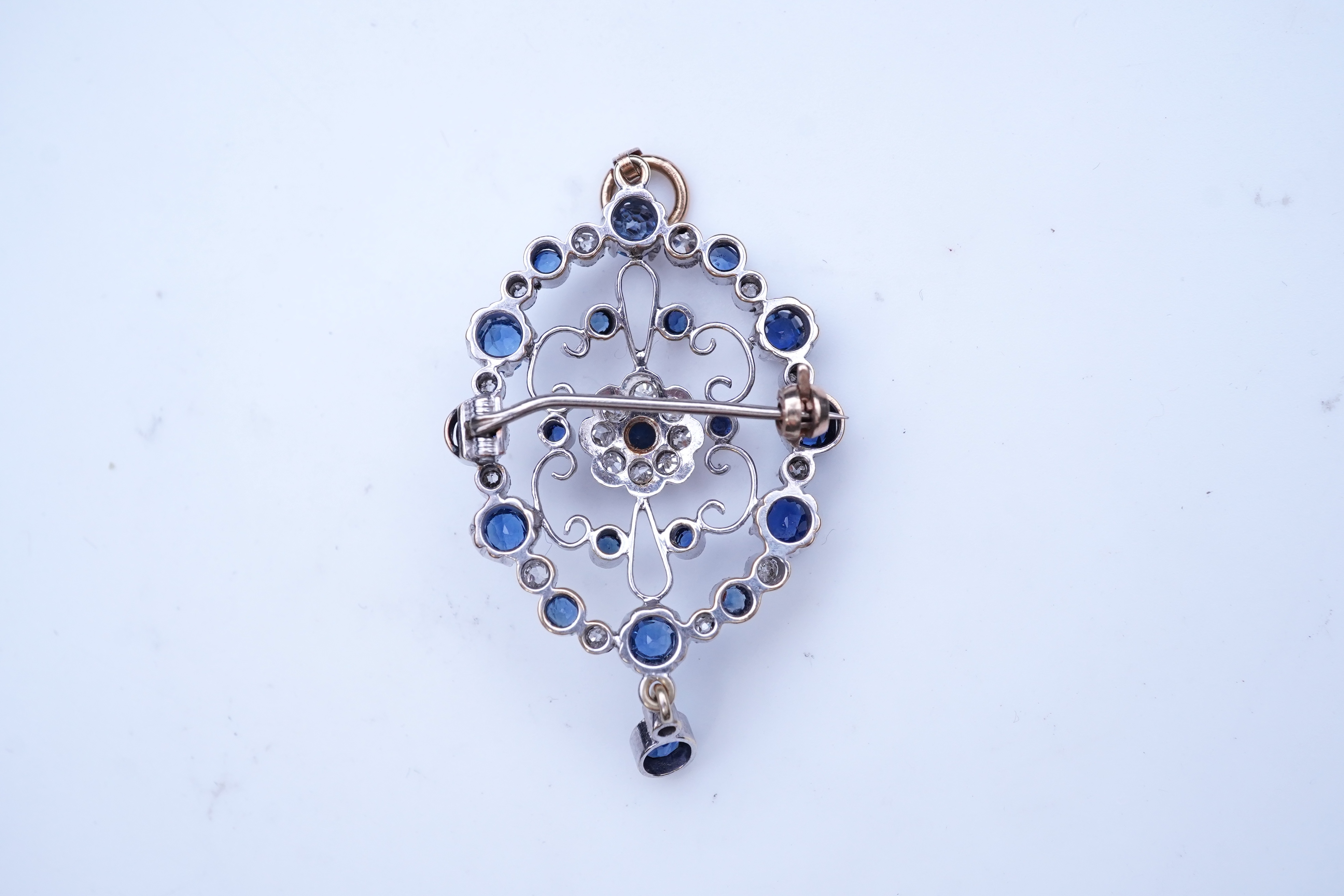 A sapphire and diamond brooch/pendant, mid 20th century